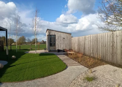 Garden office in large open garden.
