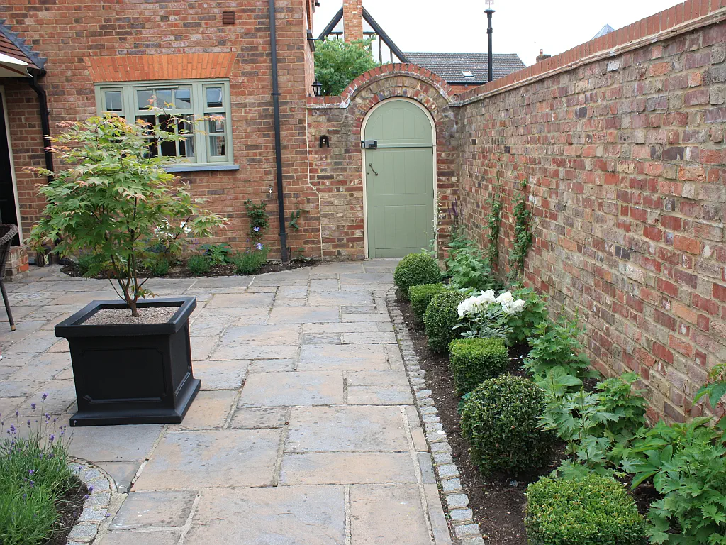 Garden gate in courtyard garden.
