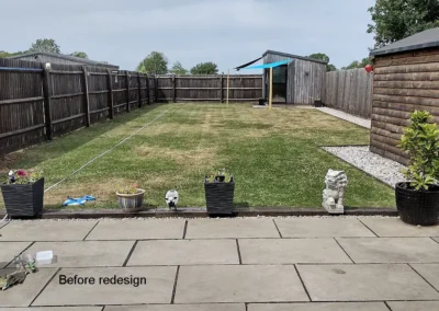 Sandstone paving with large lawn.