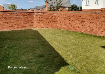 Walled garden with lawn.