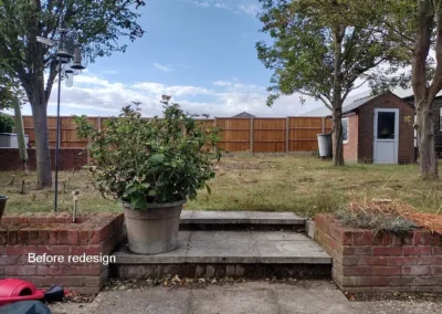 Concrete steps leading to lawn.