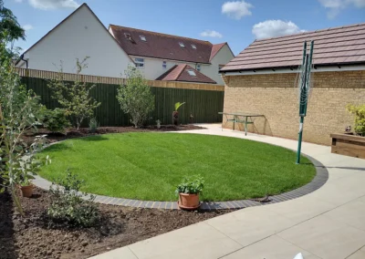 Circular lawn new build corner plot.