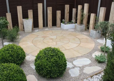 Garden retreat with sandstone circular paving.