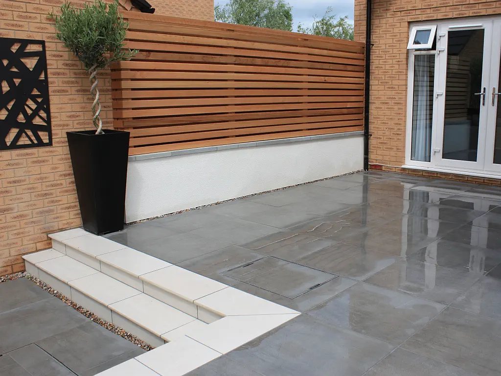 Porcelain terrace with cedar screen.