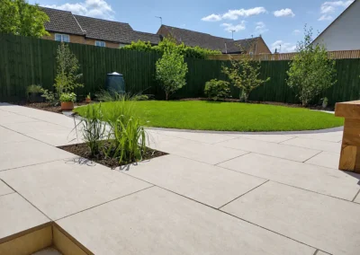 Porcelain terrace with circular lawn.