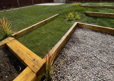 Sloping lawn with timber terracing.